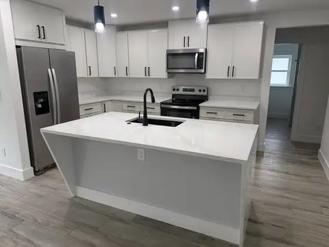 Kitchen remodel with large island and quartz countertop