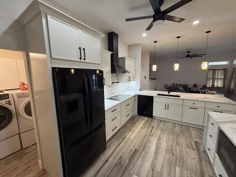 Open-concept kitchen remodel with new flooring