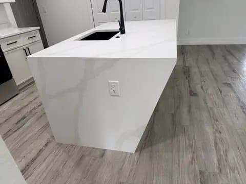 Remodeled kitchen with waterfall-edge island