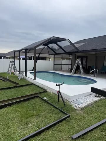Backyard pool with screened lanai enclosure