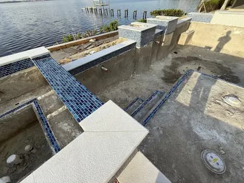 Pool coping and tile installation on a custom spa
