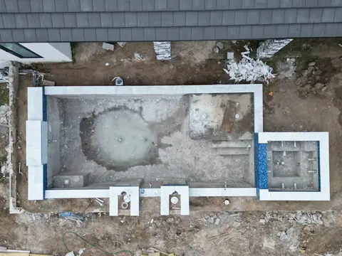 Aerial view of a new pool build during shell stage