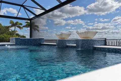 Completed pool and spa with blue mosaic tile detail