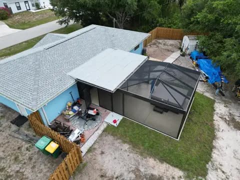 Roofing project with pool screen enclosure, drone view