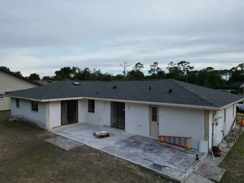 Completed roof replacement on a single-family home, aerial view